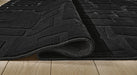 Gibbswell Washable 8' x 10' Area Rug - LasVegasFurnitureOnline.com