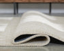 Wolbert 7'8" x 10' Area Rug - LasVegasFurnitureOnline.com